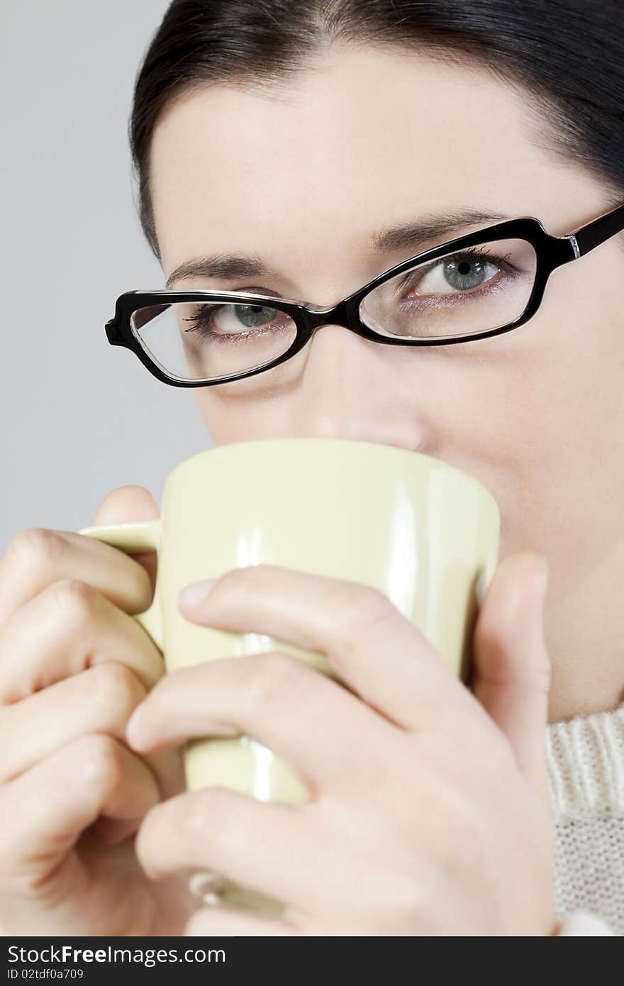 Young woman with cup, close-up. Young woman with cup, close-up