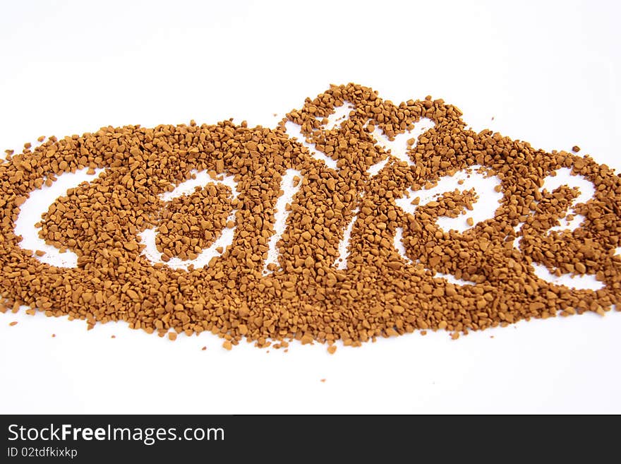 Instant coffee poured on a white background