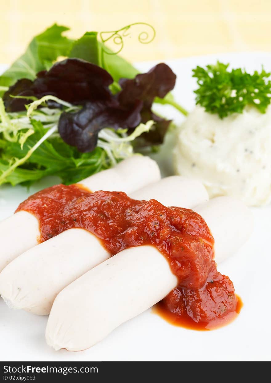 Pork Sausages With Tomato Sauce