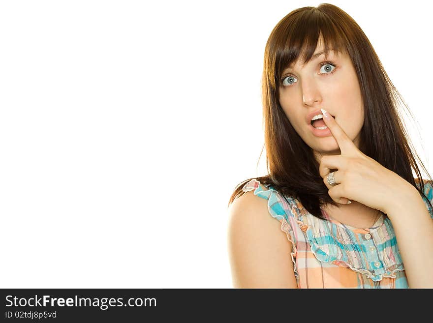 Close-up of a young woman looking surprised on white background