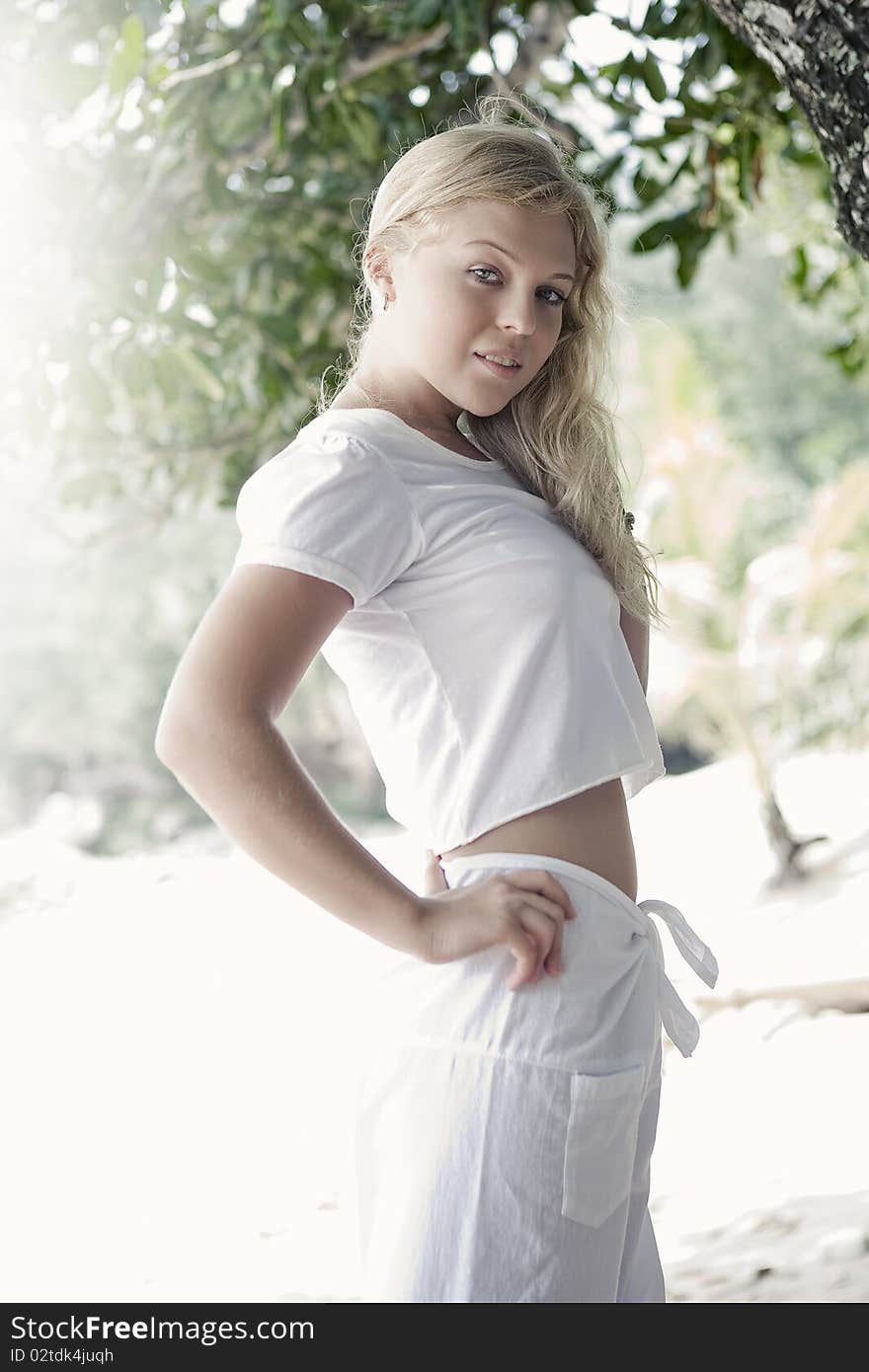 High key portrait of young beautiful woman in summer environment. High key portrait of young beautiful woman in summer environment