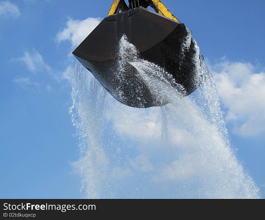 A hoisting crane unloading water