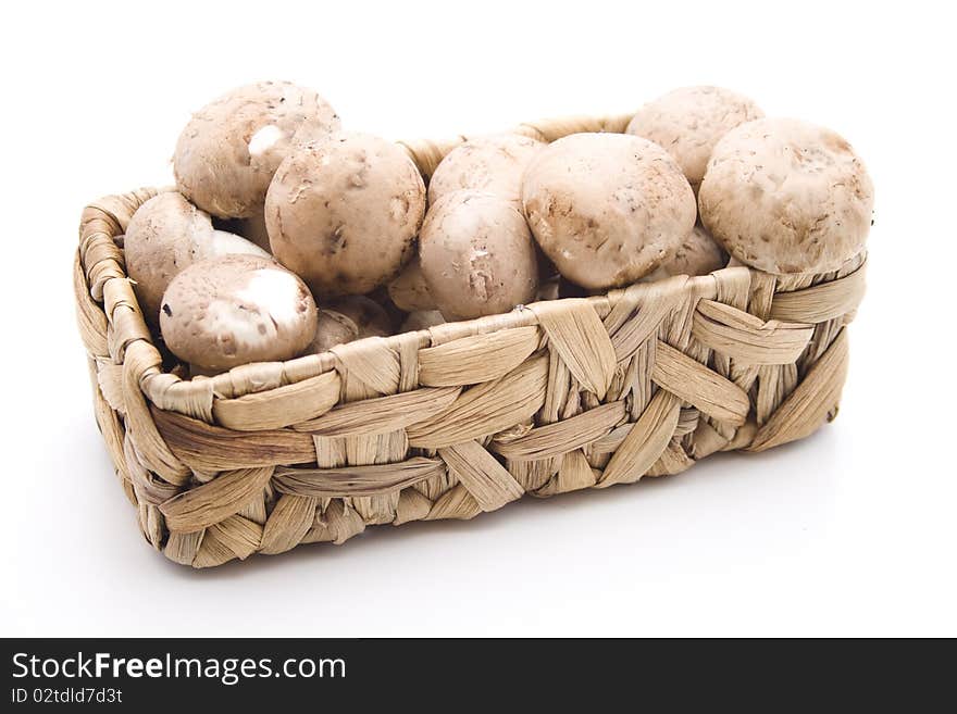 Champignon mushrooms in the basket