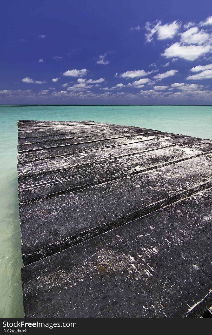 Dock leading into Carbibean water