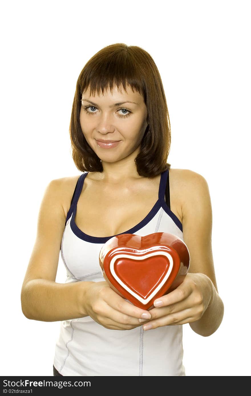 Smiling Young Woman Holding a red Heart. Lots of copyspace and room for text on this isolate. Smiling Young Woman Holding a red Heart. Lots of copyspace and room for text on this isolate