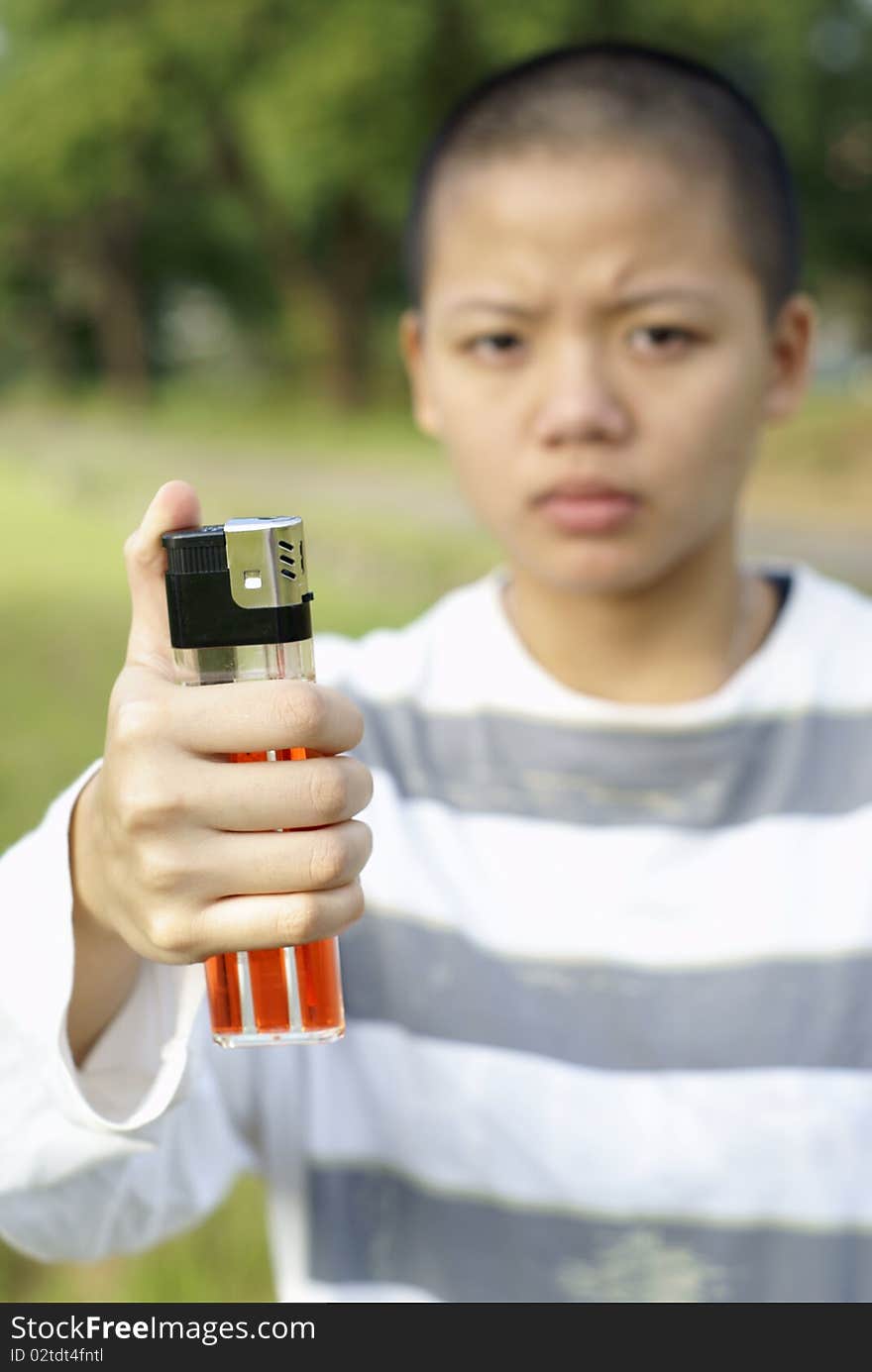 Bald person holding large lighter