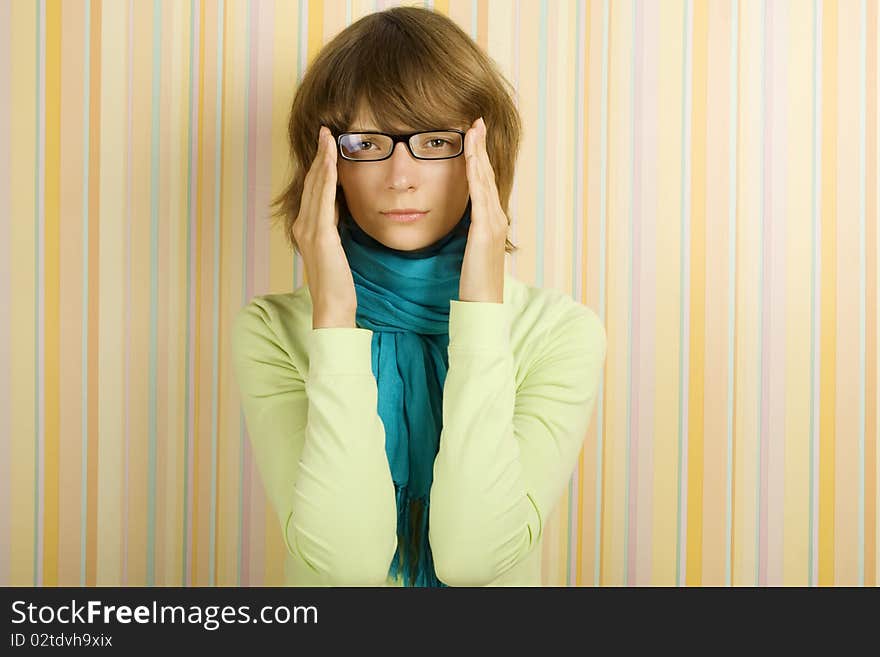 Beautiful young woman in glasses. Correcting glasses. Beautiful young woman in glasses. Correcting glasses