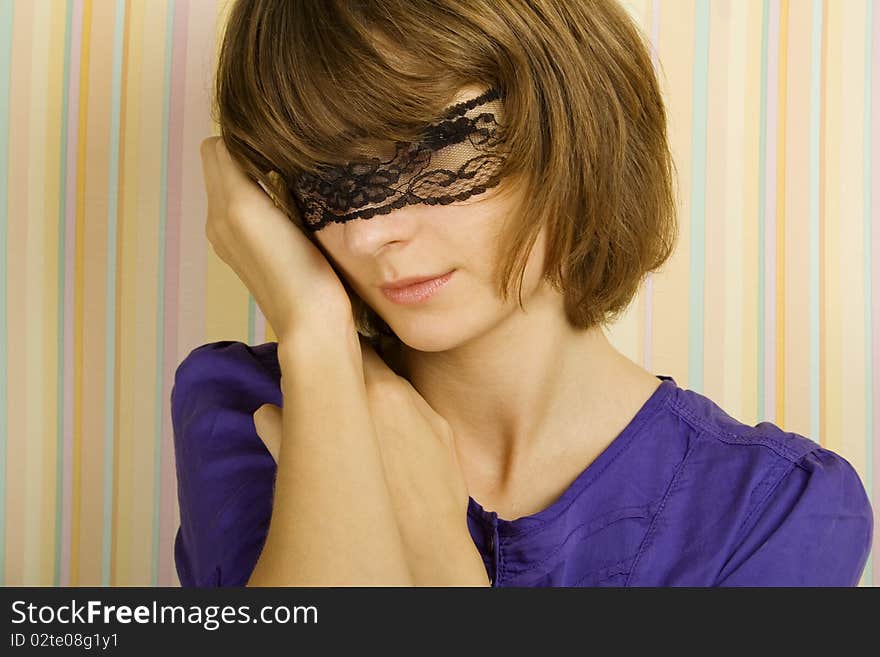 Mysterious pretty fashionable girl blindfolded black lace ribbon. Mysterious pretty fashionable girl blindfolded black lace ribbon