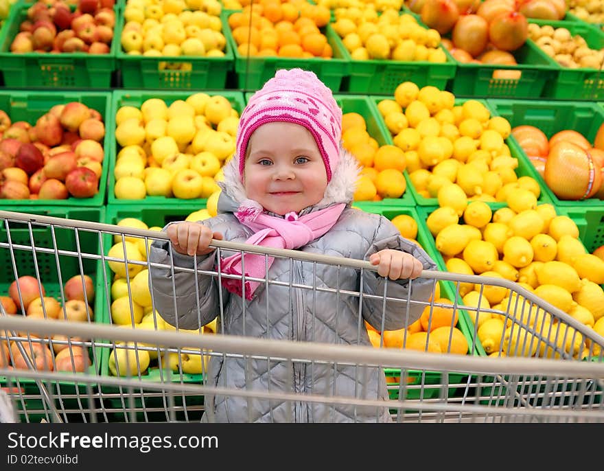 The girl with a basket in shop