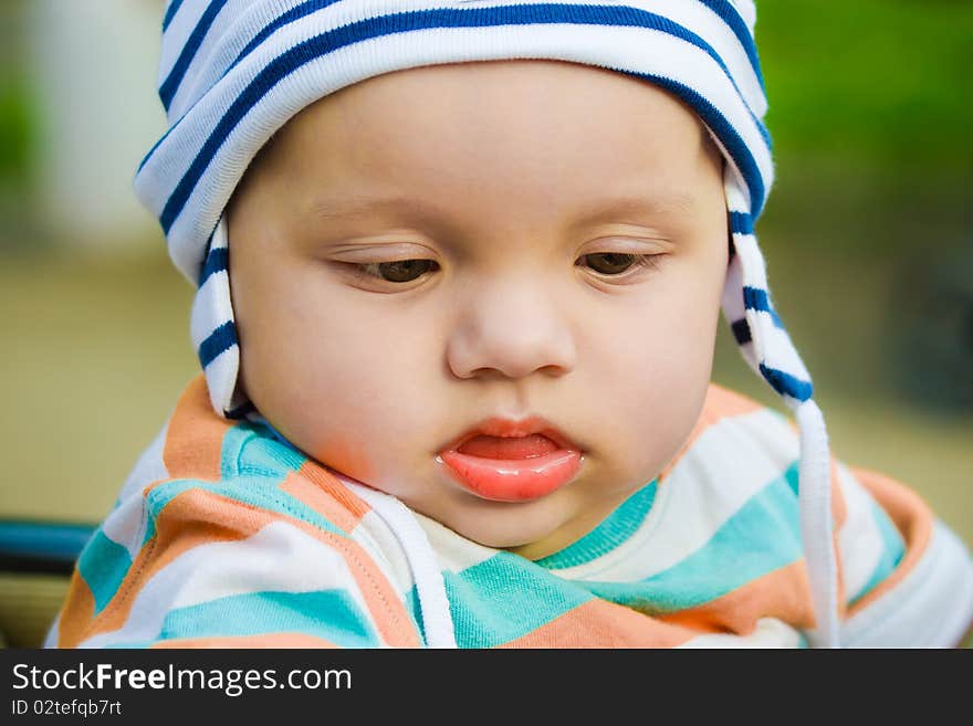 Cute kid in a striped cap