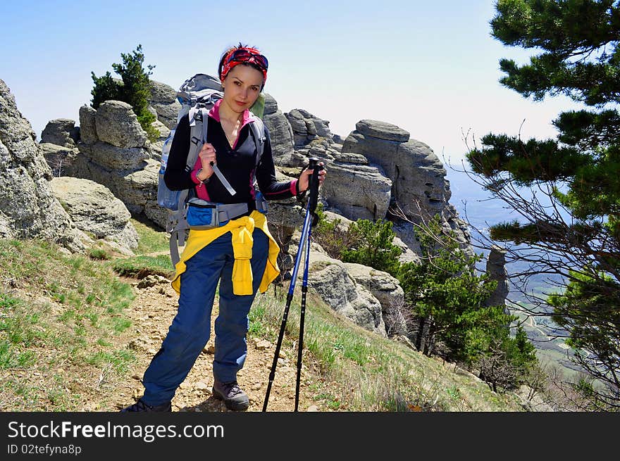 Woman tourist on top of mountains. Woman tourist on top of mountains