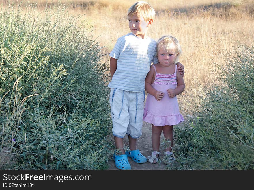 Two kids on rural background