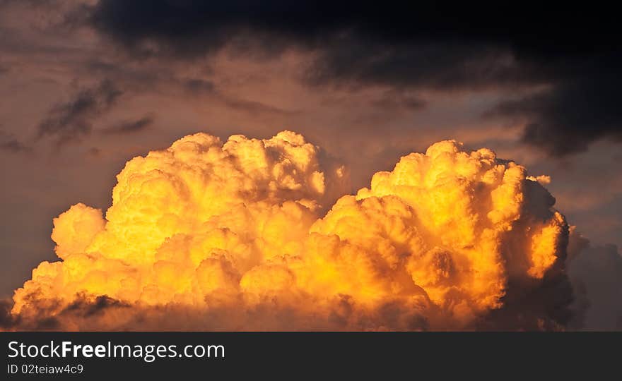 Cloud in warm light of sunset