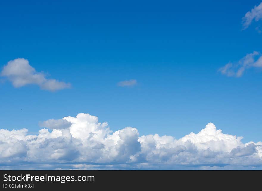 Over white clouds the blue sky