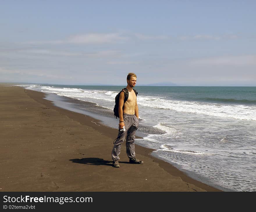 Tourists with bare-chested on the Pacific coast