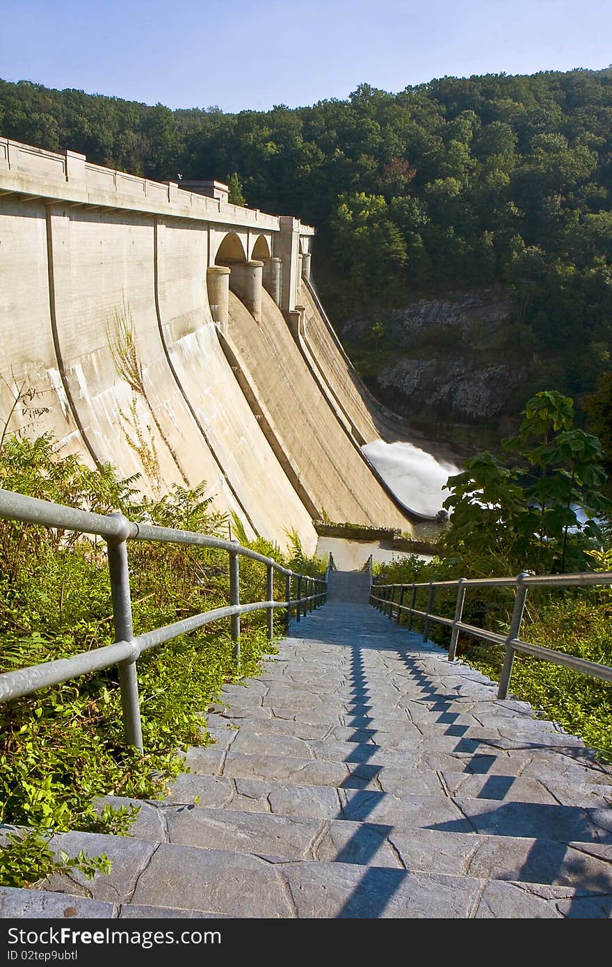 Lengthy stairway leading down to foot of large dam. Lengthy stairway leading down to foot of large dam.