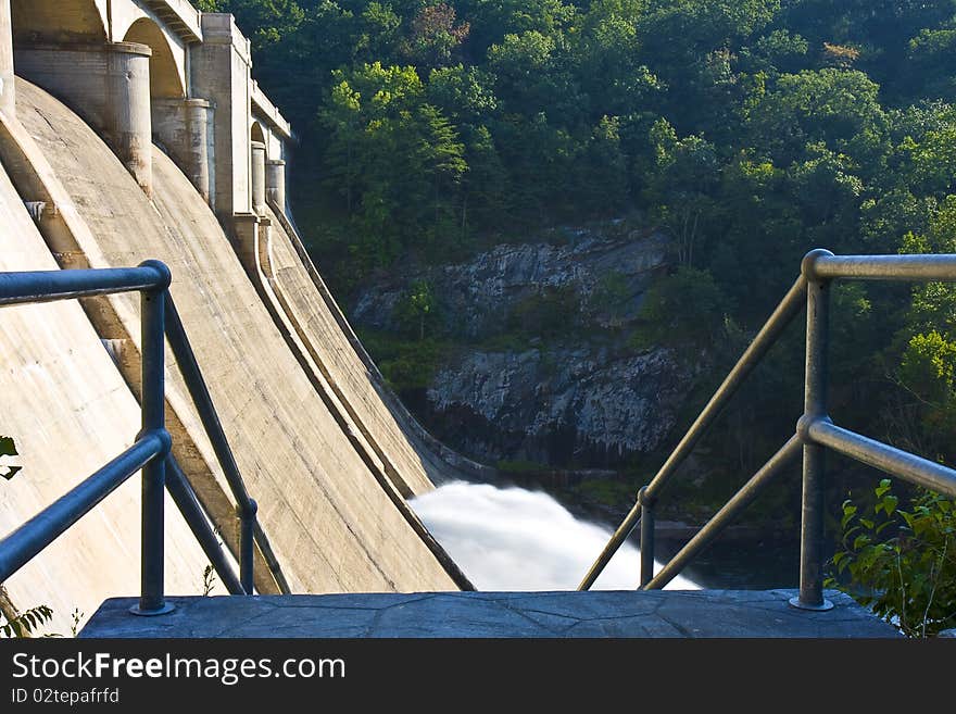 Railing and steps leading down to dam. Railing and steps leading down to dam