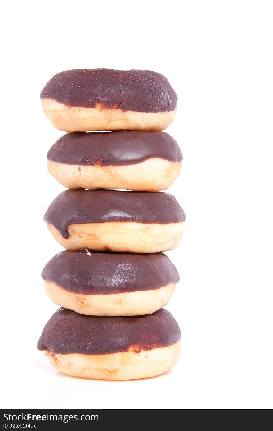 Five stacked chocolate donuts