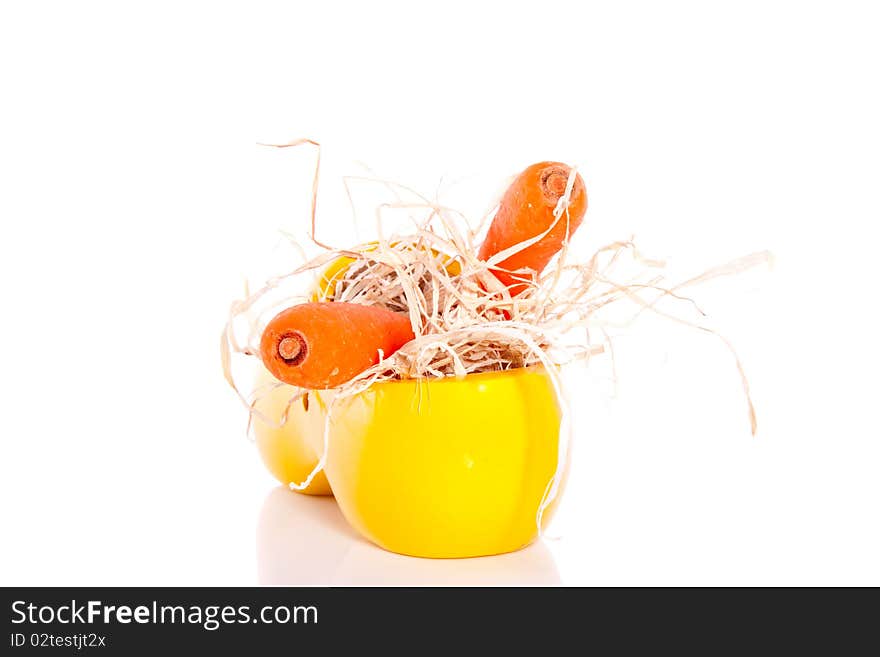 A yellow clog with carrots for the horse of Sinterklaas at five december in Holland isolated over white