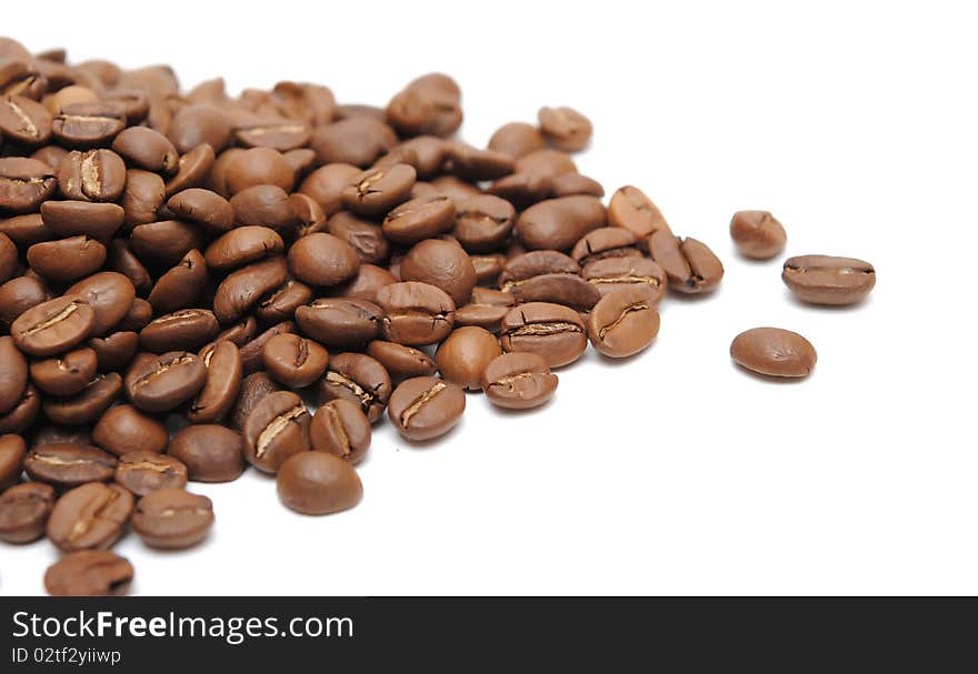 Heap of coffee beans isolated on white