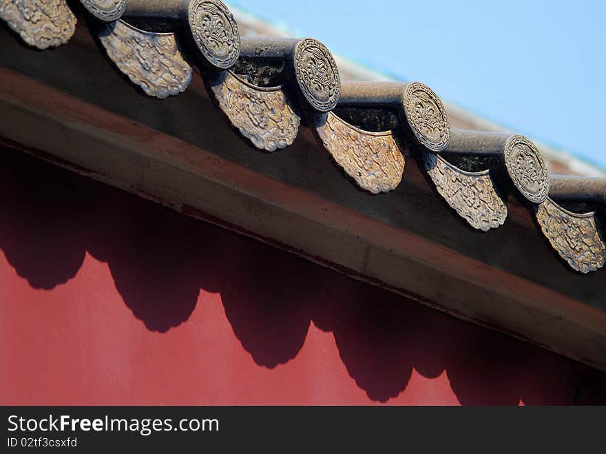 Tile on the red wall in the summer.