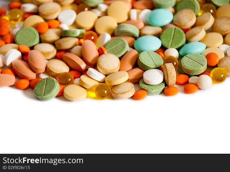 Heap of pills isolated on a white background