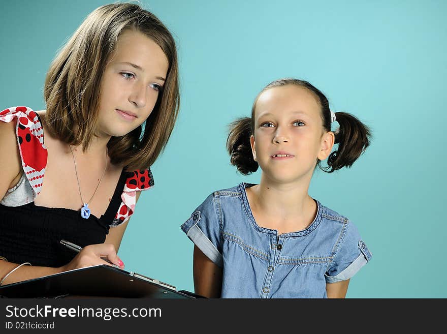 Two white children learning to write. Two white children learning to write