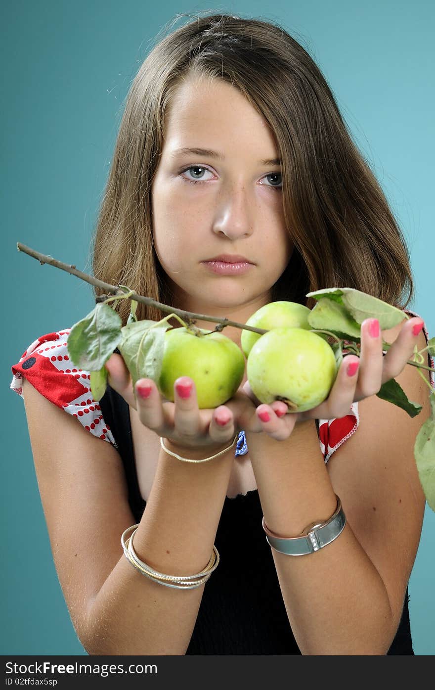 Girl showing green fruits