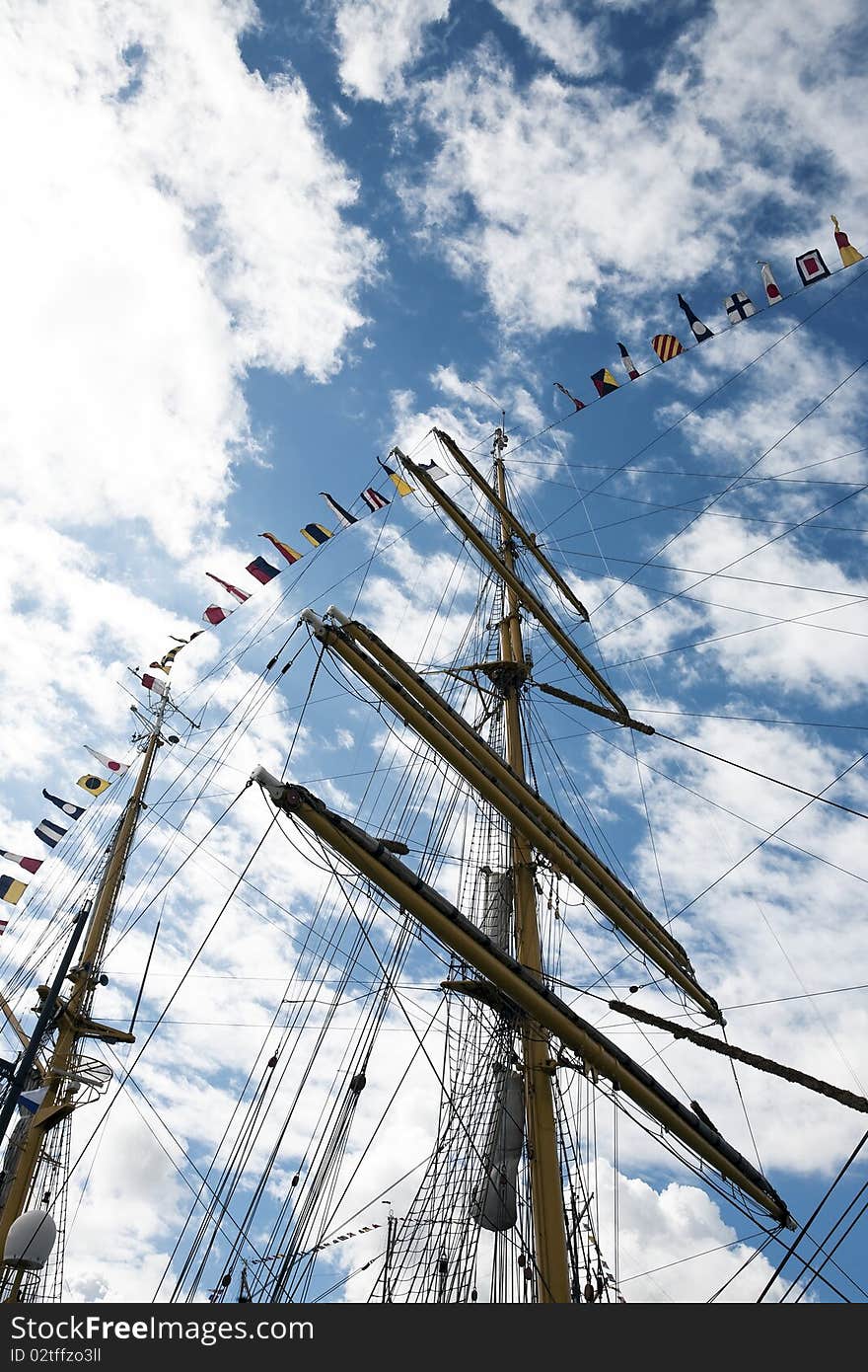 Masts of a tall Ship and cloudy blue sky. Masts of a tall Ship and cloudy blue sky