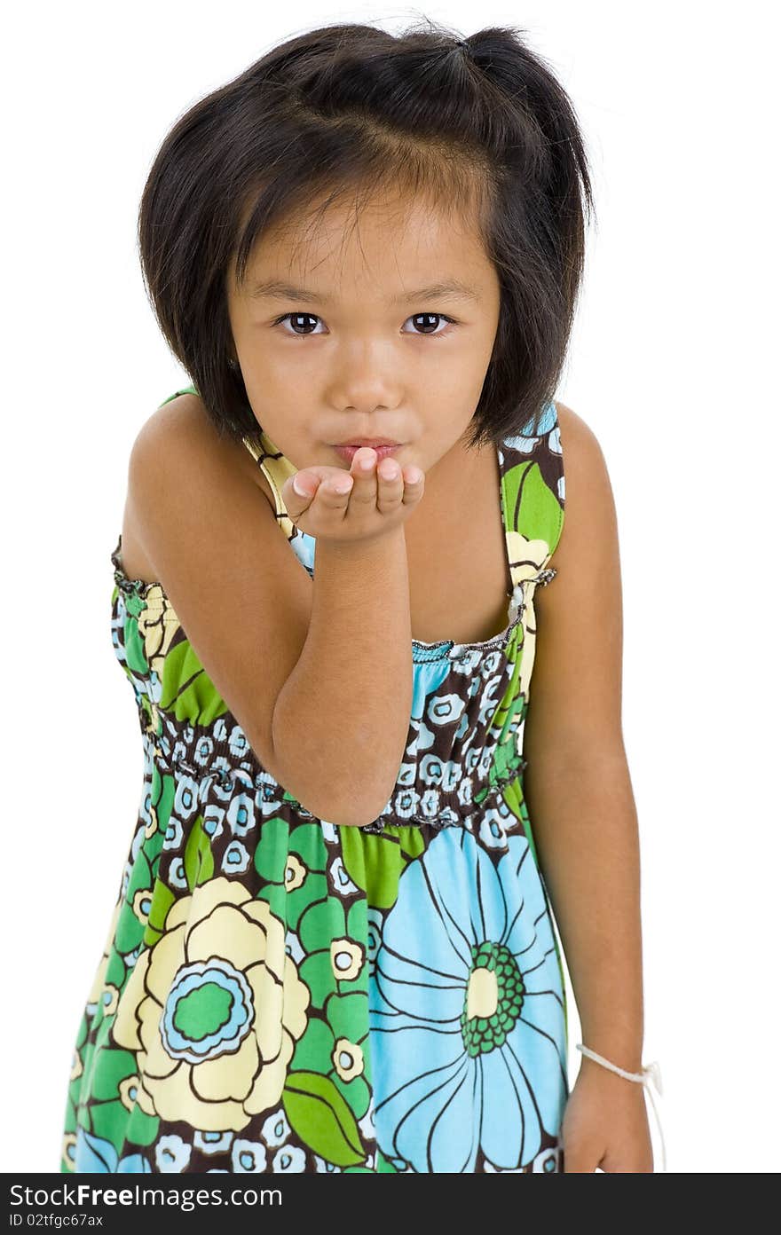 Beautiful little asian girl blowing a kiss, isolated on white background. Beautiful little asian girl blowing a kiss, isolated on white background