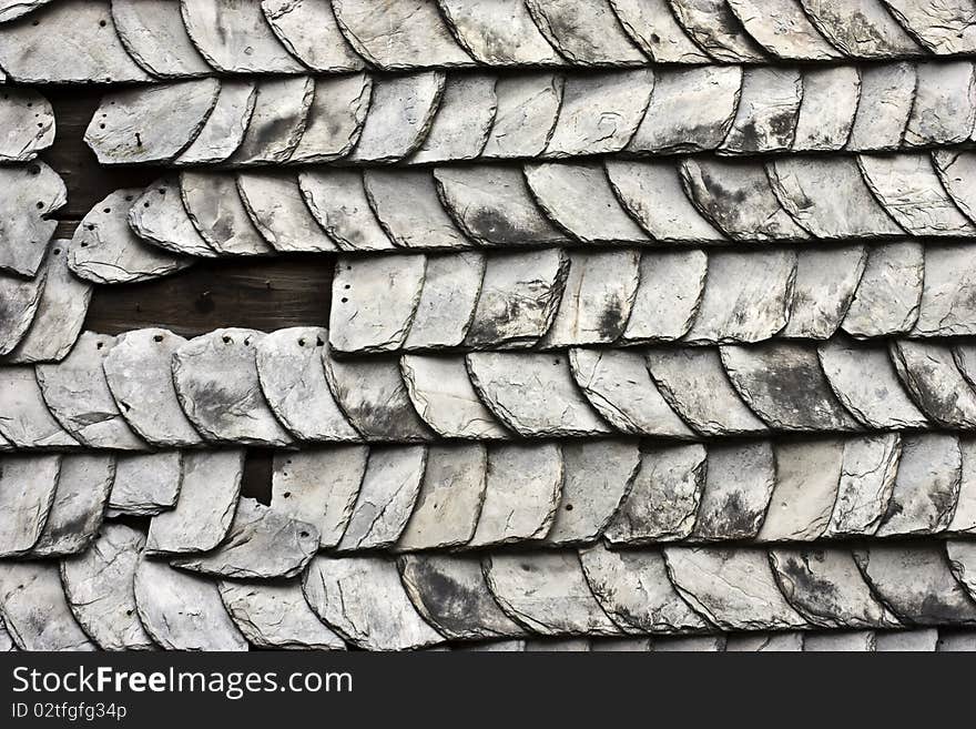 An old damaged roof with missing parts