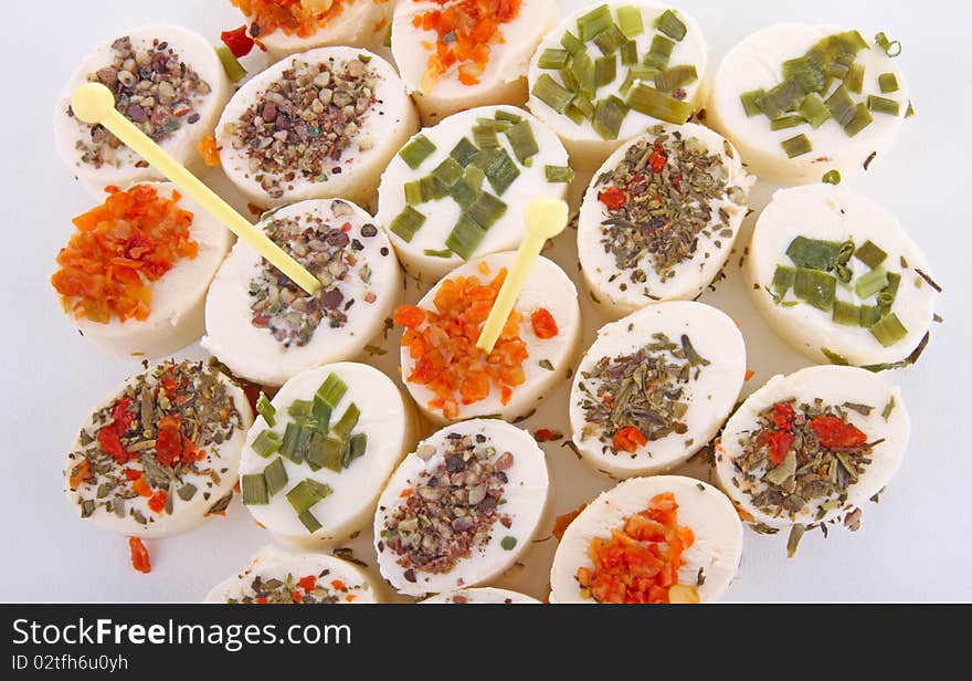 Cheese appetizers on white background