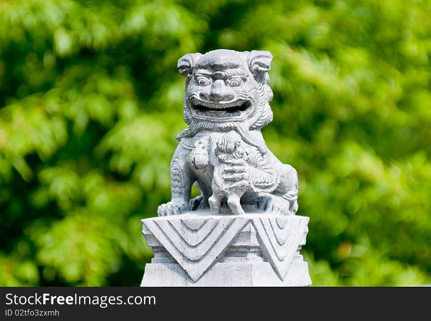 A chinese lion statue usually infront of gates and enterances for good luck.