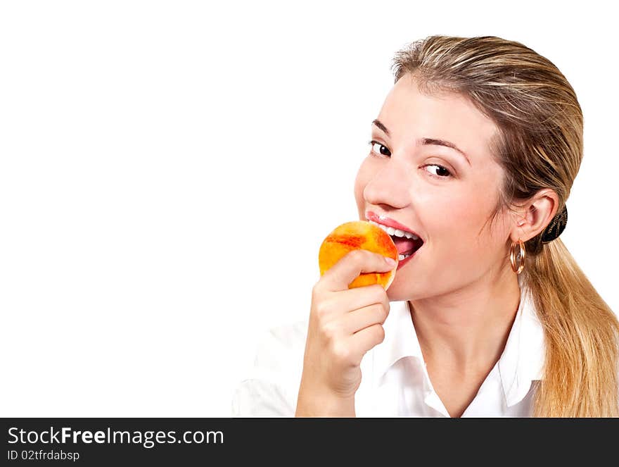 Office girl eating ripe yellow tasty peach. Office girl eating ripe yellow tasty peach