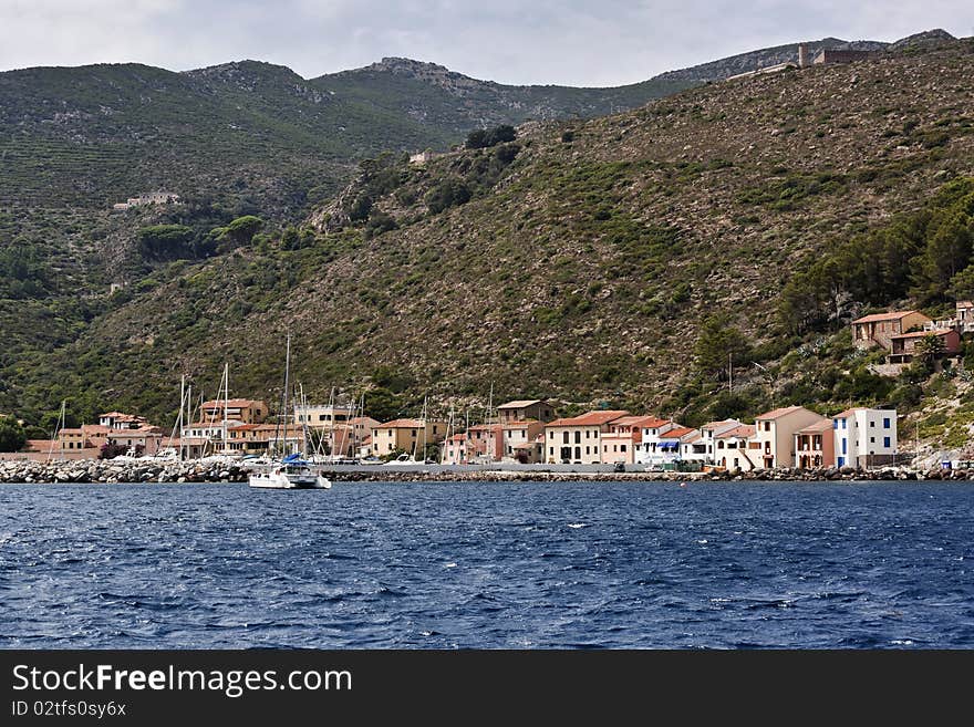 Italy, Tirrenian sea, Tuscanian islands, Capraia island, panoramic view of the port. Italy, Tirrenian sea, Tuscanian islands, Capraia island, panoramic view of the port