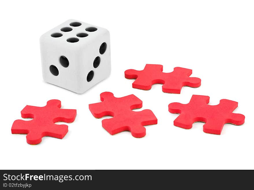 Dice and puzzle isolated on white background