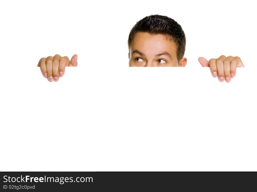 Young guy holding blank billboard