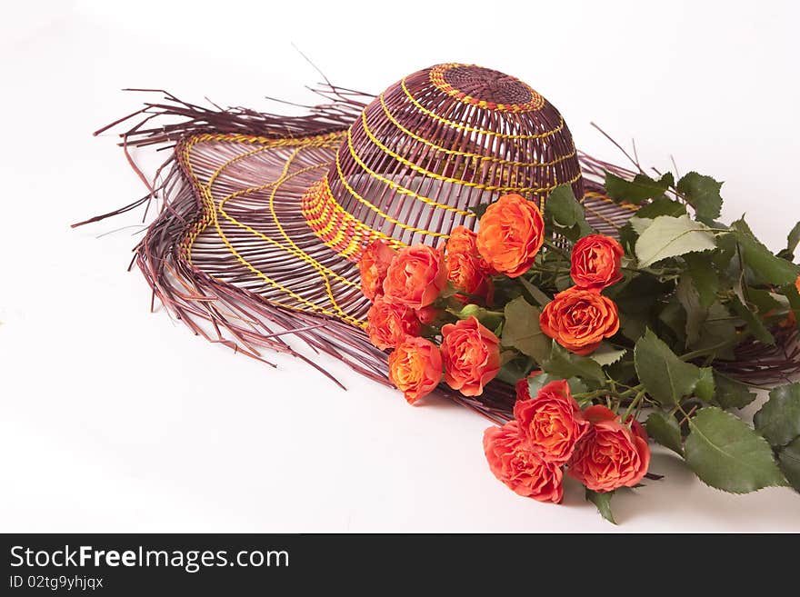 flowers roses and an orange hat