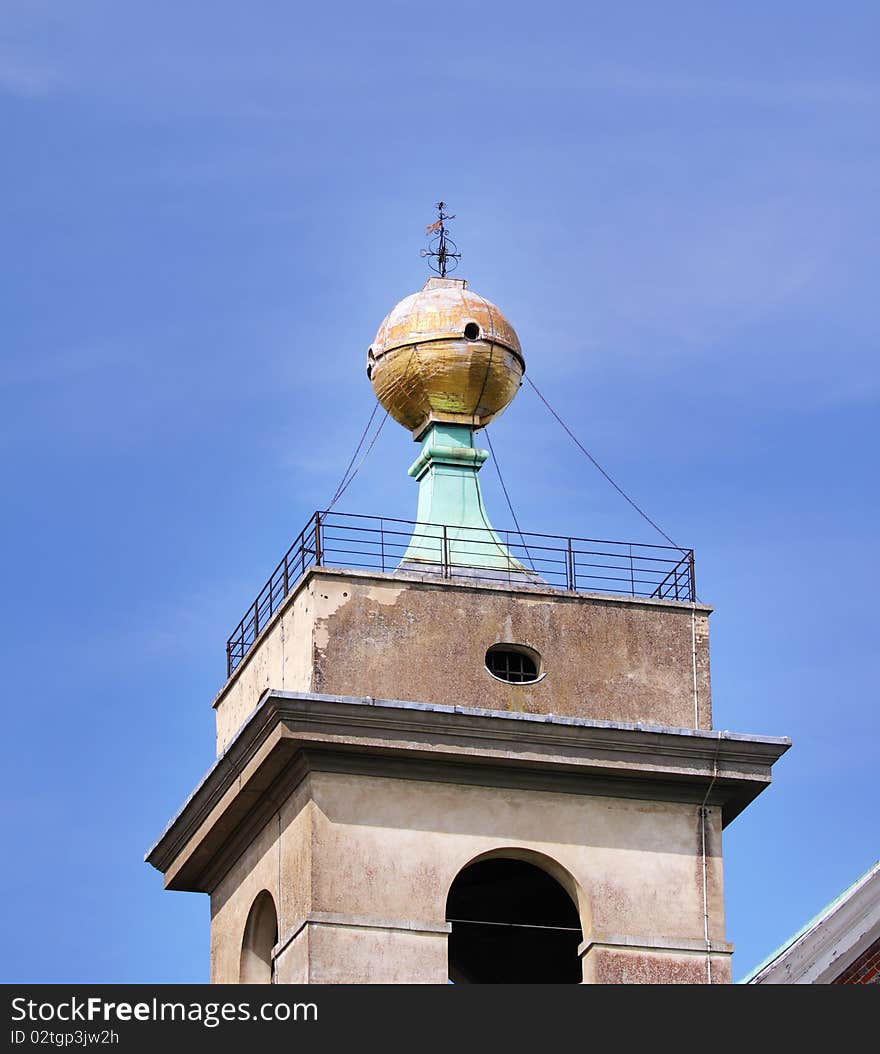 The Golden Ball Monument and weathervain on top of West Wycombe Church Tower in England