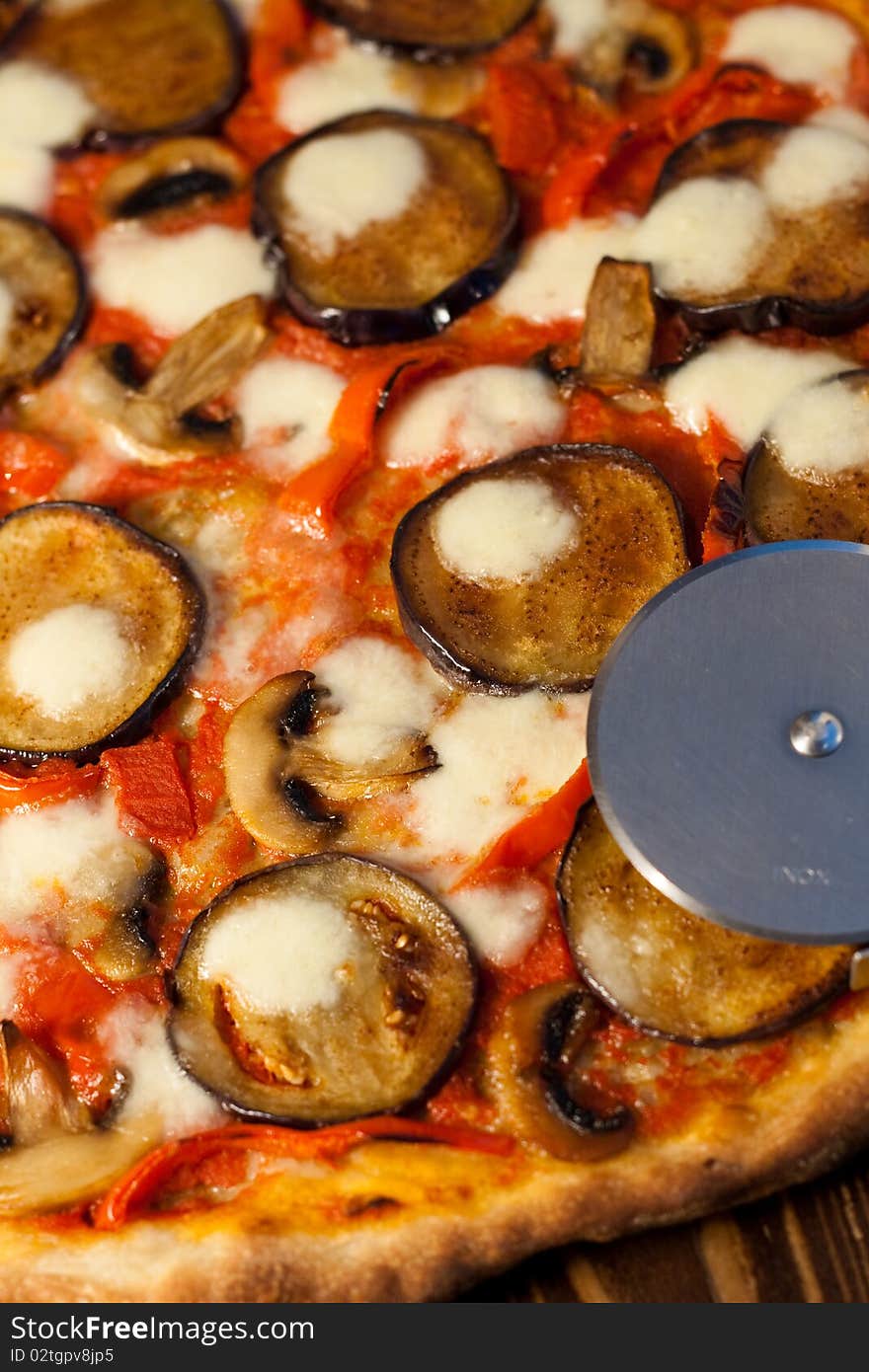 Italian pizza with eggplants, bell peppers and mushrooms. Italian pizza with eggplants, bell peppers and mushrooms