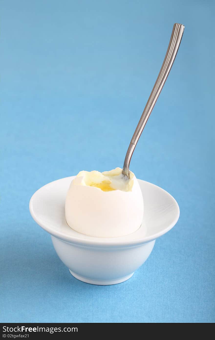 Image of soft boiled egg on a blue background