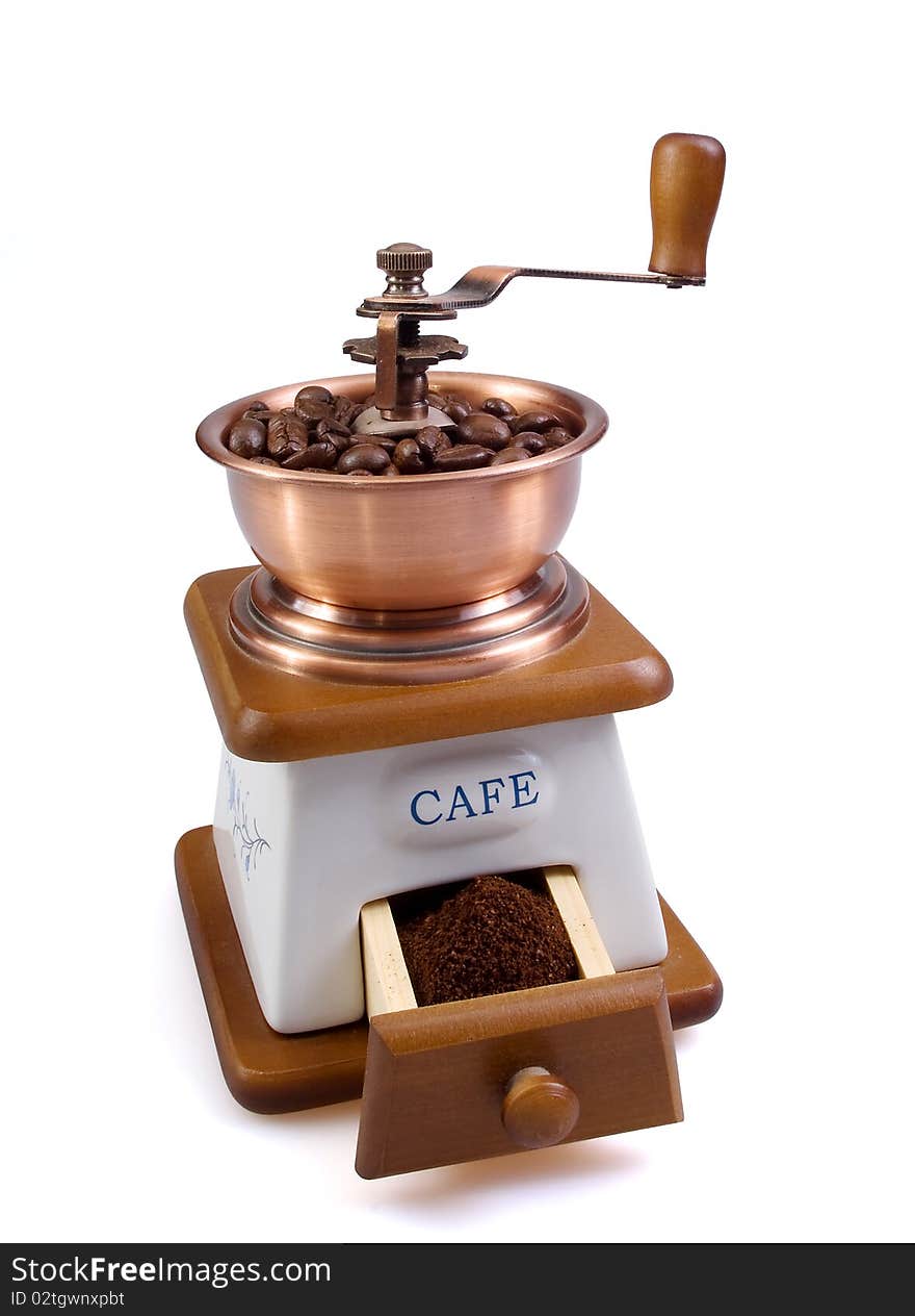 White coffee grinder with coffee grains