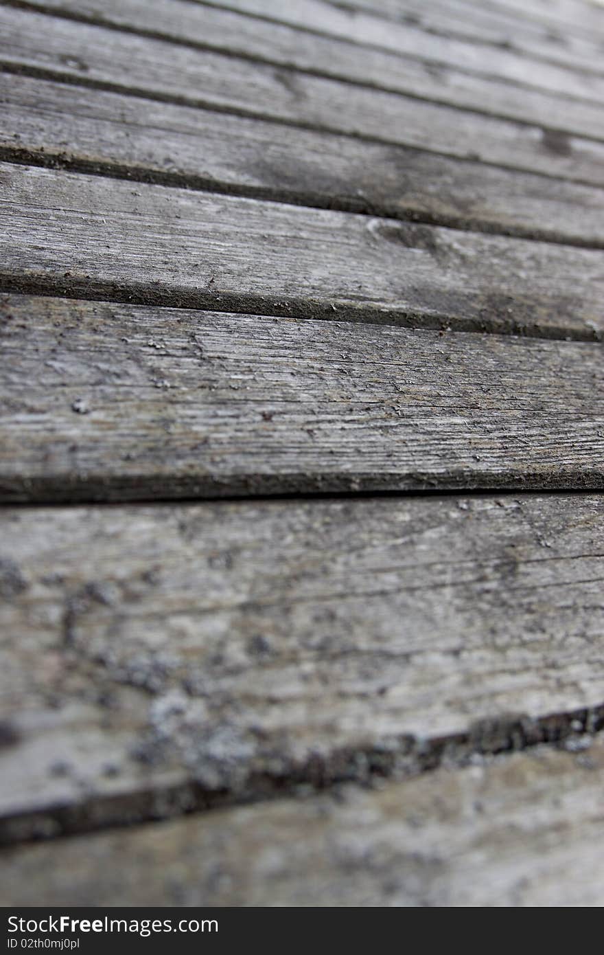 Very old boards with splinters are photographed as a structure