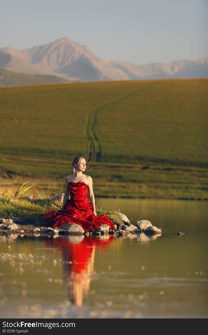 The girl on the bank of lake