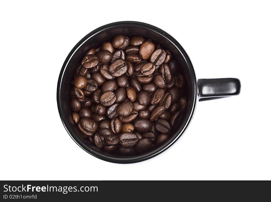 Black coffee cup with coffee grains isolated on white background