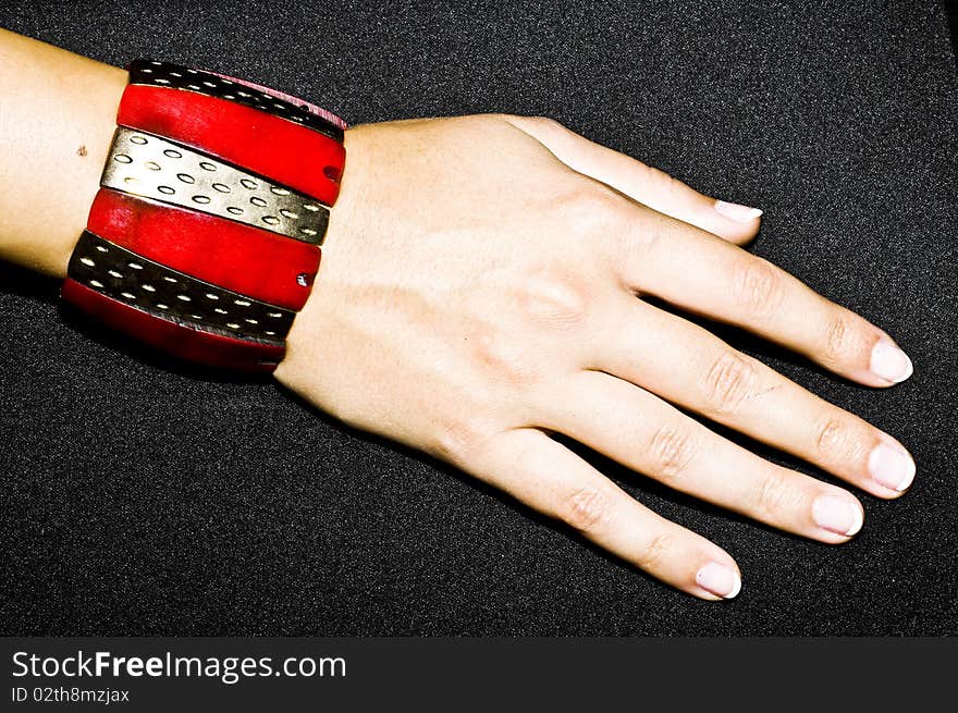 Red oriental bracelet on woman hand