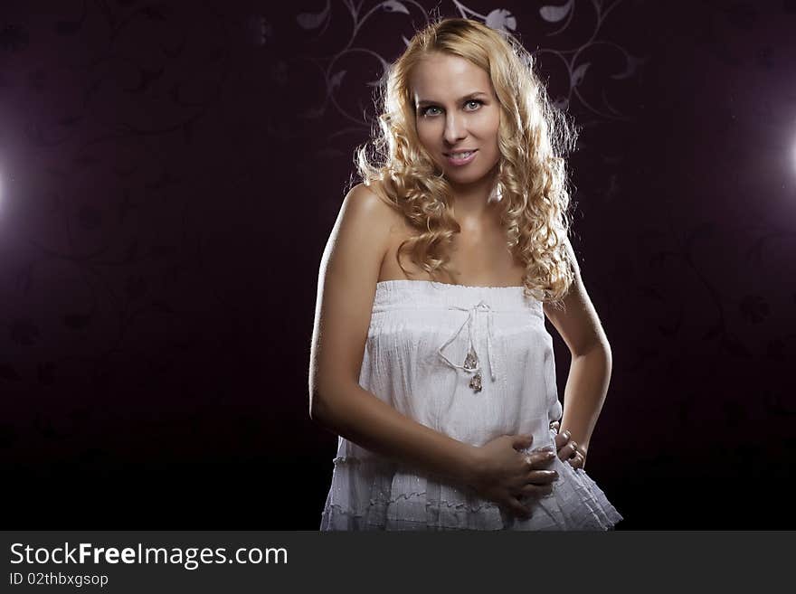 The image of a beautiful girl on a dark background