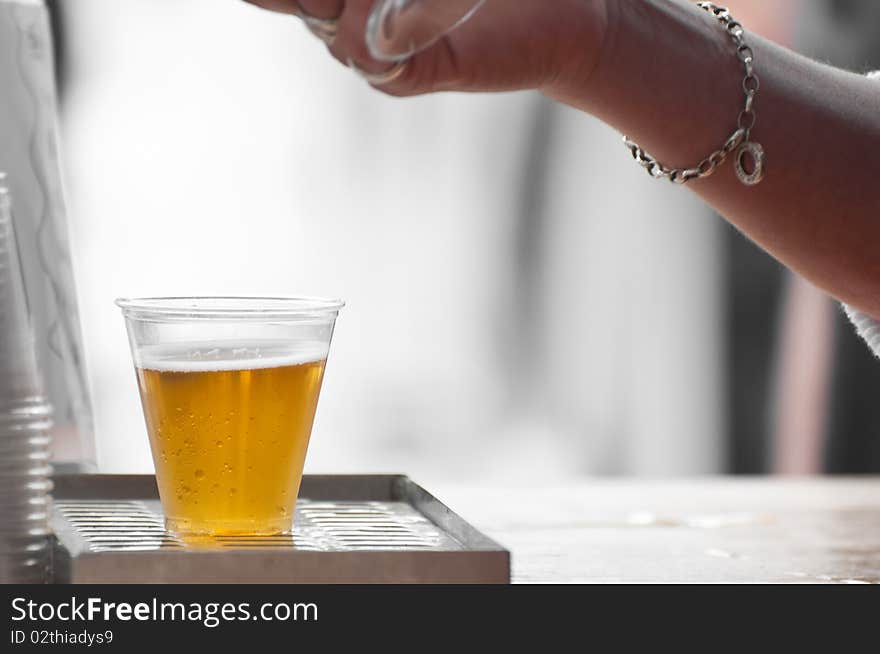 Beer in a plastic glass. Beer in a plastic glass