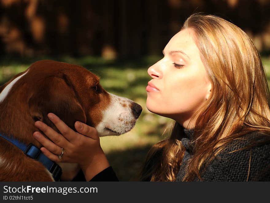 A beautiful girl enjoying a moment with her best friend. A beautiful girl enjoying a moment with her best friend.