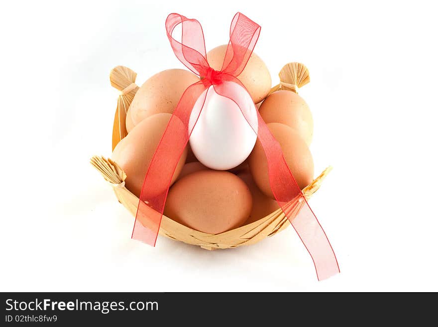 Eggs in a basket and a red bow